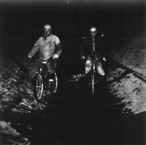 Construction Workers Ride Bikes in Clear Creek Tunnel